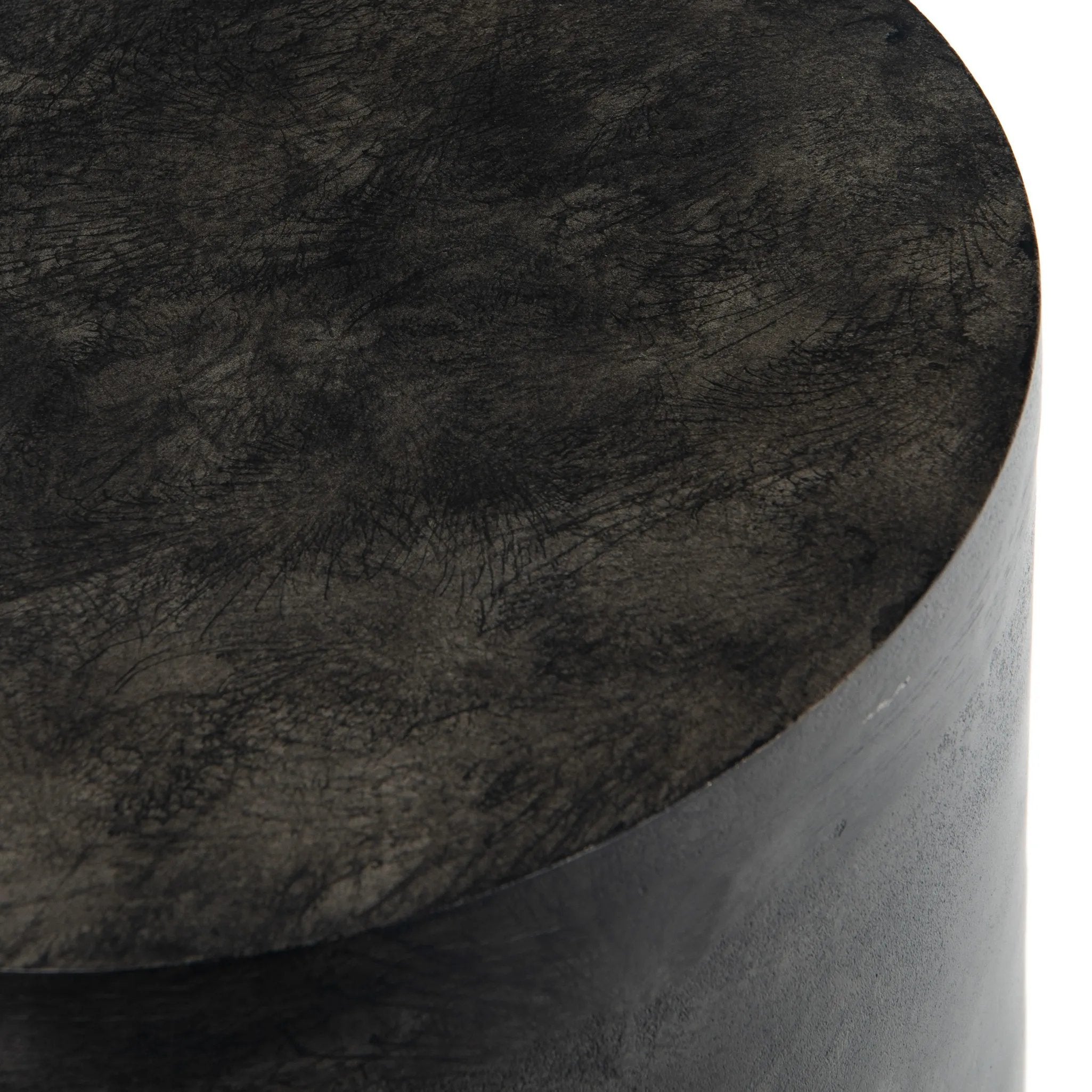 Made from raw black-finished iron, a chunky end table inspired by Brutalist-era shaping brings an industrial vibe to any room Amethyst Home provides interior design, new home construction design consulting, vintage area rugs, and lighting in the Boston metro area.