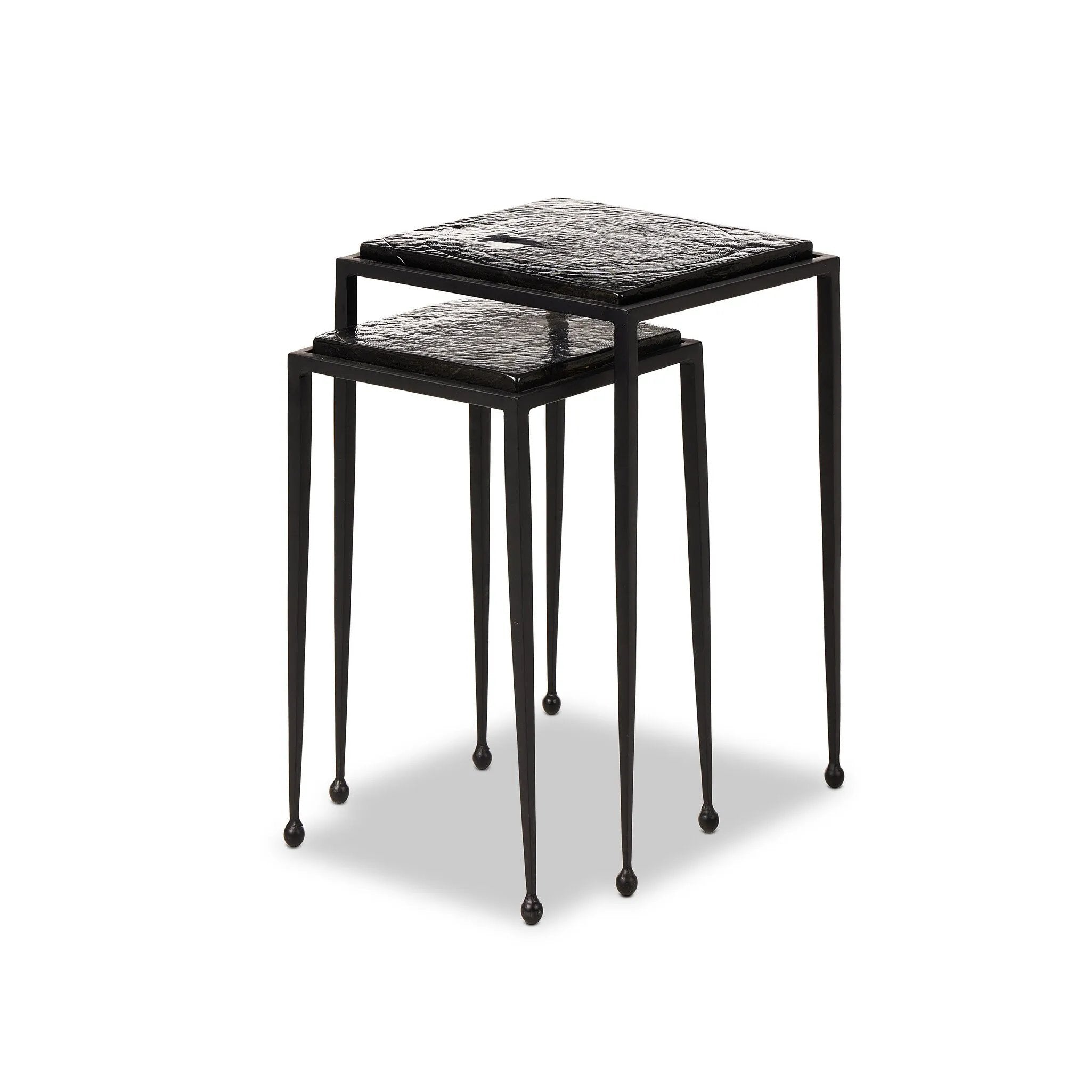 Slim, airy bases of black-finished iron support two varied-height nesting tables of smoked black glass. Designed to bunch or pull apart as desired, with ease Amethyst Home provides interior design, new home construction design consulting, vintage area rugs, and lighting in the Tampa metro area.