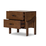 Made from brown-finished ash with leather-wrapped hardware, wide scale and sculptural details reflect the Brazilian midcentury inspiration behind this dual-drawer nightstand Amethyst Home provides interior design, new home construction design consulting, vintage area rugs, and lighting in the Houston metro area.