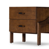 Made from brown-finished ash with leather-wrapped hardware, wide scale and sculptural details reflect the Brazilian midcentury inspiration behind this dual-drawer nightstand Amethyst Home provides interior design, new home construction design consulting, vintage area rugs, and lighting in the San Diego metro area.