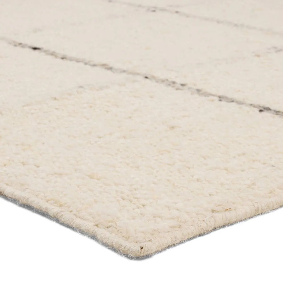 With its lofty, handmade loops, the Coart rug is an inviting, textural essential. Crafted of 100% undyed wool, its natural, relaxed, persona is met with a crisp, contemporary grid pattern.  An outstanding union of artistry and contemporary style, its physical approachability, monochromatic palette, and modern minded restraint are spot on.Handwove Amethyst Home provides interior design, new home construction design consulting, vintage area rugs, and lighting in the Austin metro area.