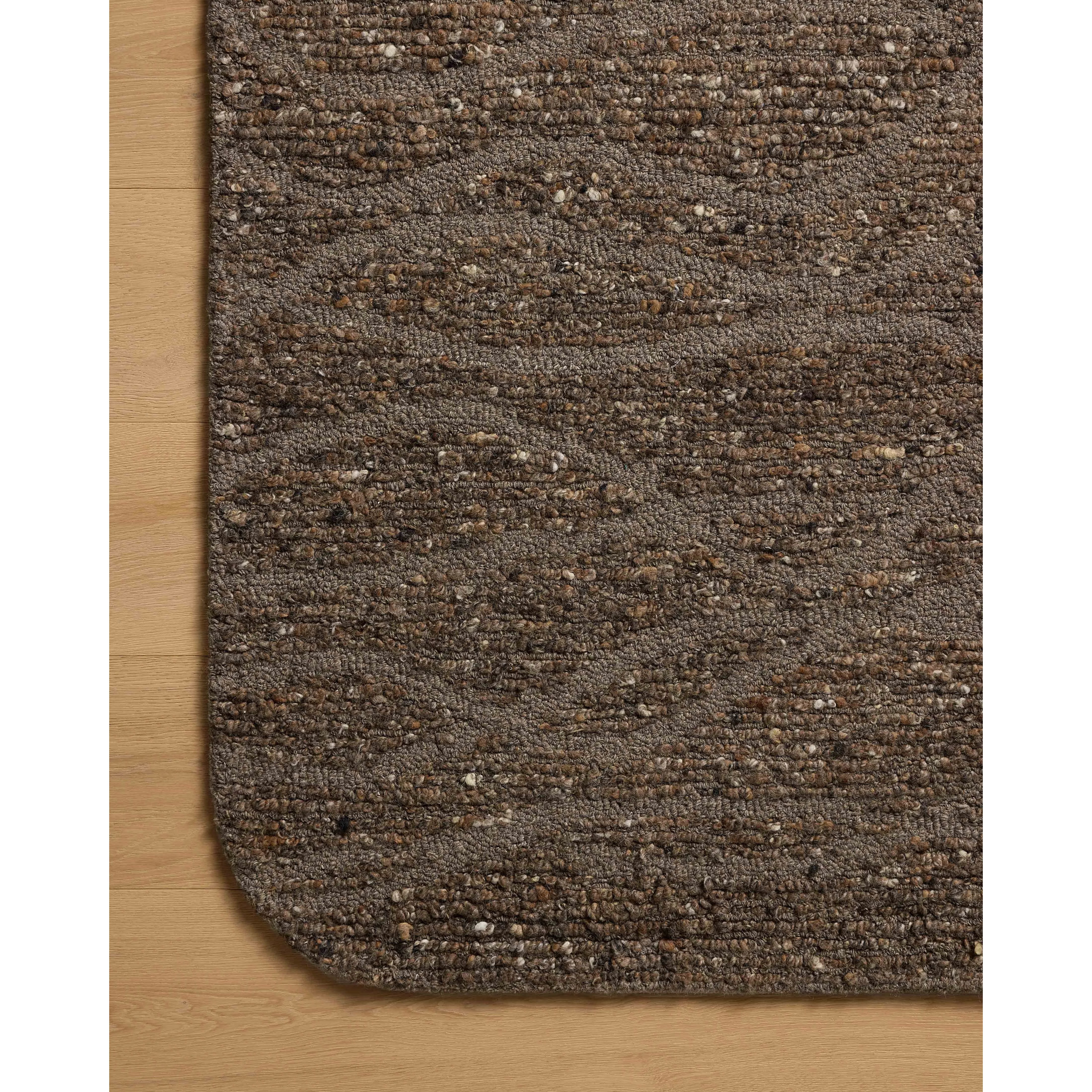 The Otis Collection is a hand-tufted area rug with an organic design and uniquely rounded edges. This design-forward collection features loose linear patterns in heathered, natural colors to ground living rooms, bedrooms, dining rooms, and more. Amethyst Home provides interior design, new home construction design consulting, vintage area rugs, and lighting in the Seattle metro area.