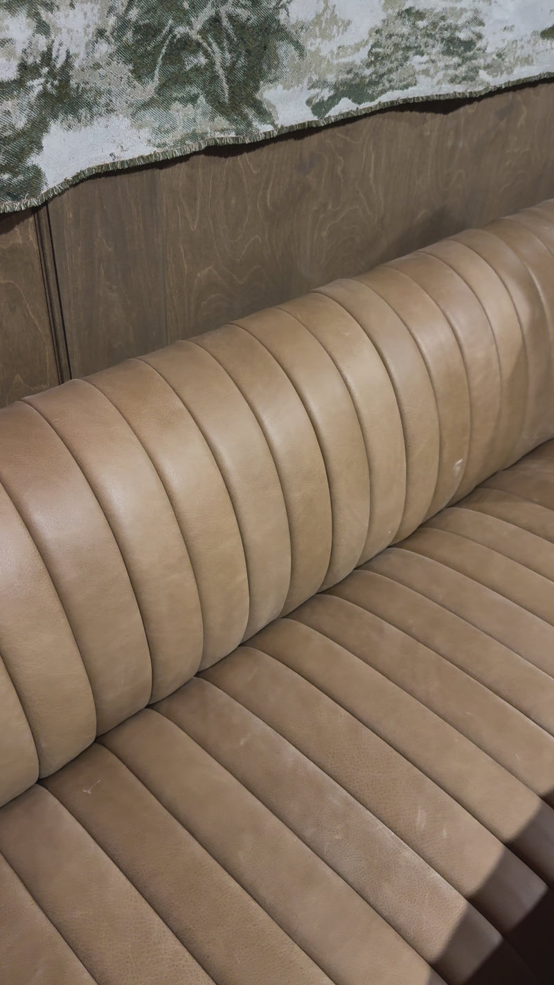 The beauty of this modular piece is that the vertical channeling makes for a cohesive feel despite being modular. Your new favorite place to enjoy morning coffee. A U-shaped dining banquette is upholstered in tan top-grain leather with a beautifully pronounced grain and dramatic channeling for a linear look.Overall Dimensions: 119.50"w x 66.50"d x 31. Amethyst Home provides interior design, new home construction design consulting, vintage area rugs, and lighting in the Calabasas metro area.