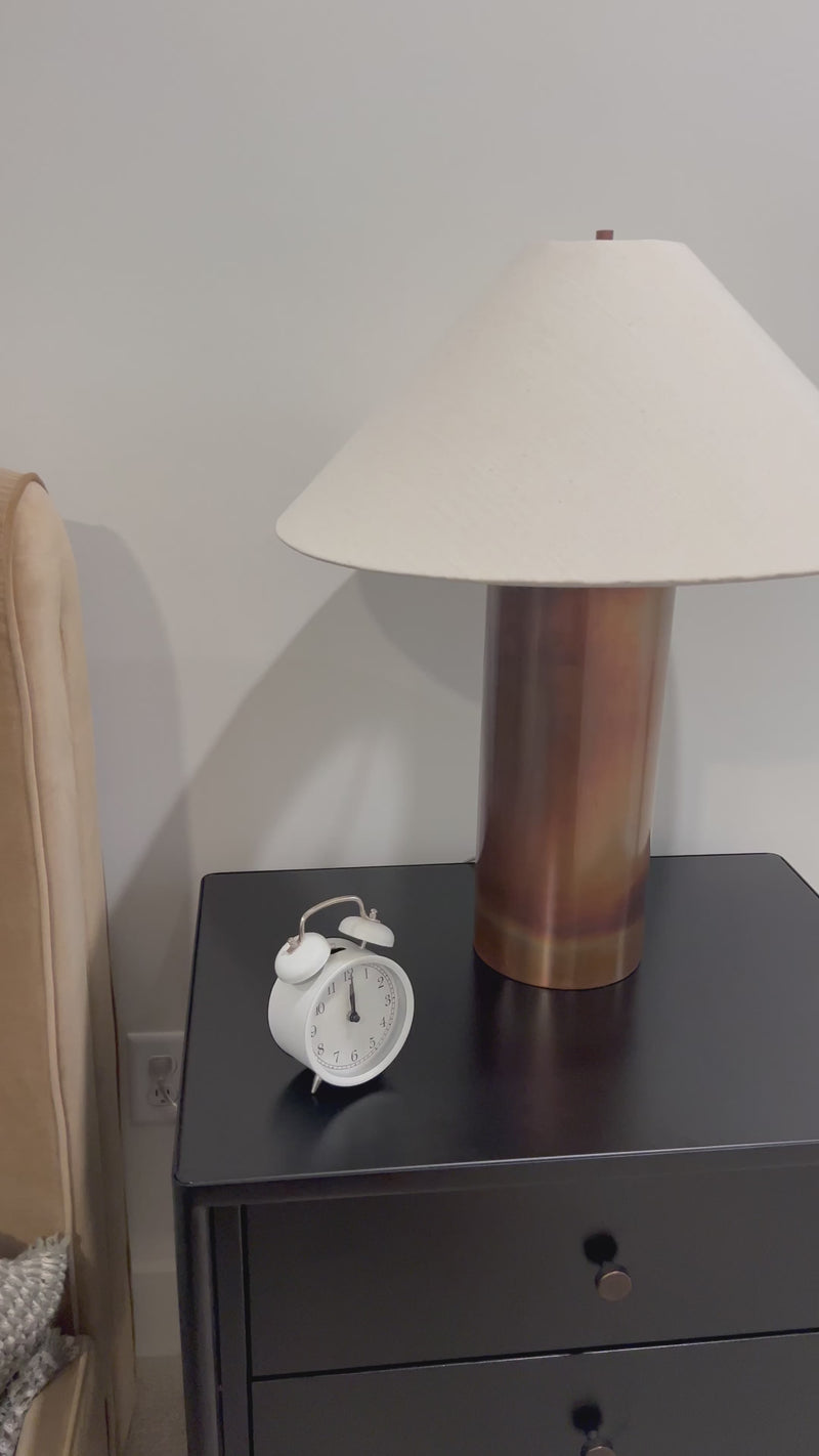 All-metal table lamp finished with a unique process to accomplish its iridescent acid wash look. The metal is first polished, then oxidized. It's finished with a heating process and lacquer seal for an antiqued look, complemented by a simple linen shade.Overall Dimensions: 20.00"w x 20.00"d x 24.00"hWeight : 7. Amethyst Home provides interior design, new home construction design consulting, vintage area rugs, and lighting in the Seattle metro area.