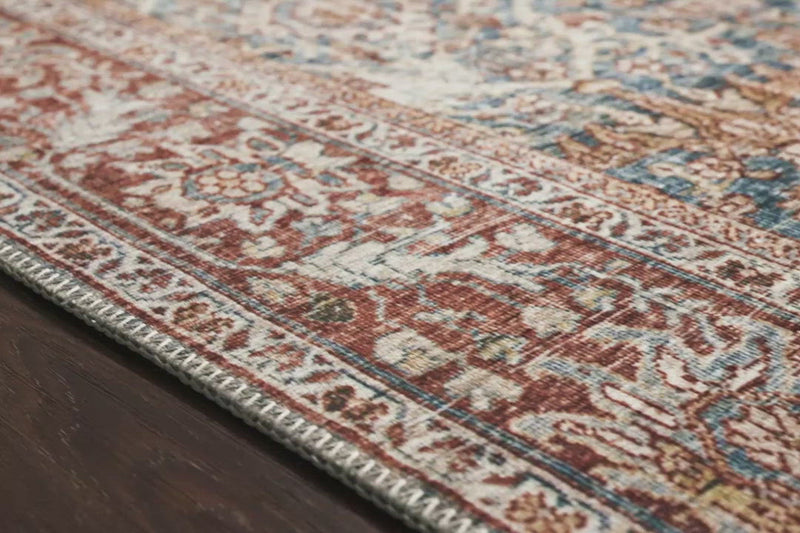 The Layla Collection is traditional and timeless, with a beautiful lived-in design that captures the spirit of an old-world rug. This traditional power-loomed rug is crafted of 100% polyester with a classic and sophisticated color palette and subtle patina.  Power Loomed 100% Polyester LAY-04 Ocean/Rust