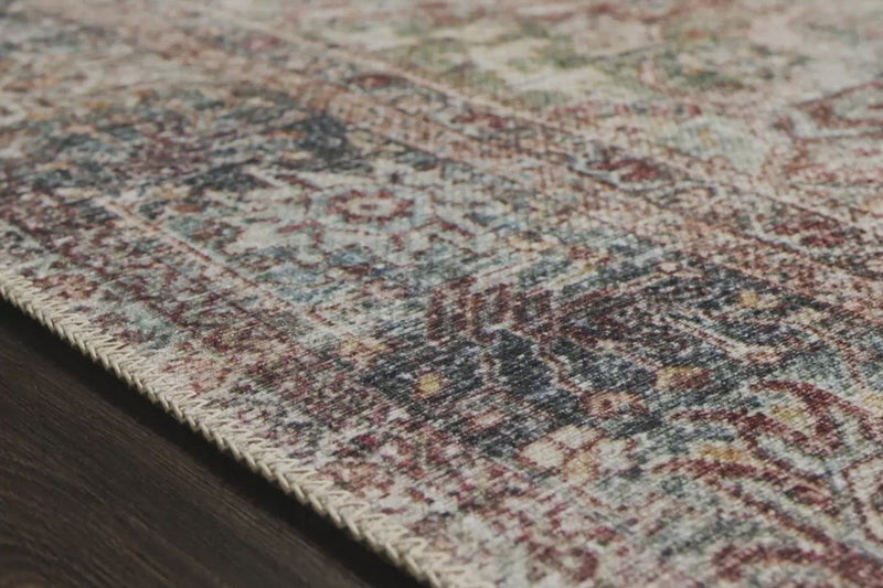 The Loren Brick/Multi area rug from Loloi captures the spirit of a one-of-a-kind vintage or antique area rug. You will love this rug because the rug is:   Perfect for families with kids and pets Very easy to clean and maintain Comes in big area rug sizes and as cute kitchen and hallway runners Looks gorgeous with the intricate pattern and patina Warms up any room with tones of blue, red, and ivory Power Loomed 100% Polyester LQ-14 Brick/Multi Colors: Blue, Red, Ivory