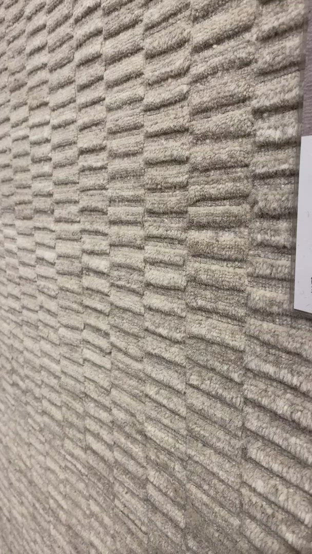 Natural beauty is expressed in an understated fashion with the Hadley Collection, an eco-friendly collection of 100% undyed wool. Loom knotted in India, Hadley features an intriguing cut pile and loop combination which adds distinctive texture to these handsome and durable designs. Also, the muted colors fit easily with a variety of interior styles while still earning notice with raw elegance.  Hand Loomed 100% Wool India HD-04 Oatmeal