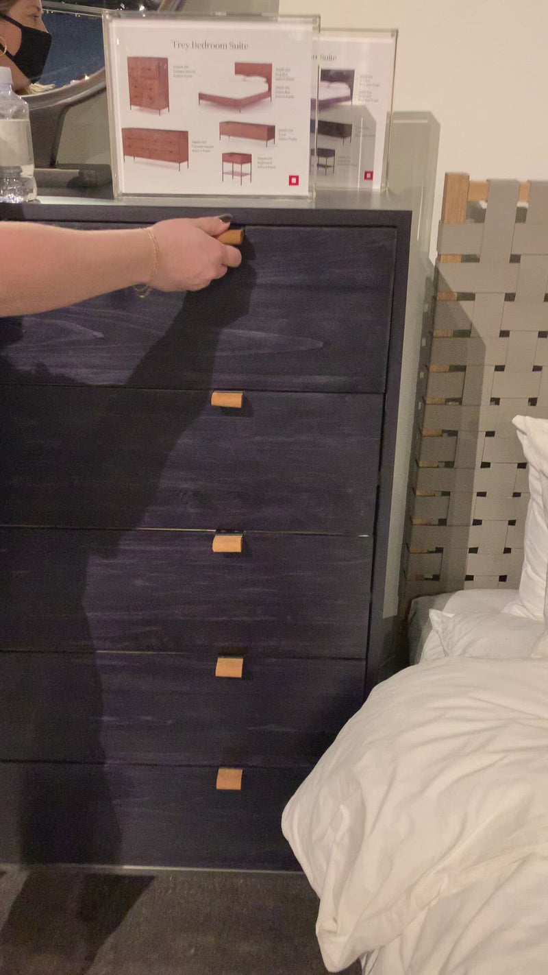 The toffee leather handles of this Trey 5 Drawer Dresser - Black Wash Poplar bring a classy pop of color and texture to the space. A stylish dresser of black-washed poplar offers plenty of bedroom storage space thanks to five spacious drawers.   Overall Dimensions: 36.00"w x 18.00"d x 49.00"h
