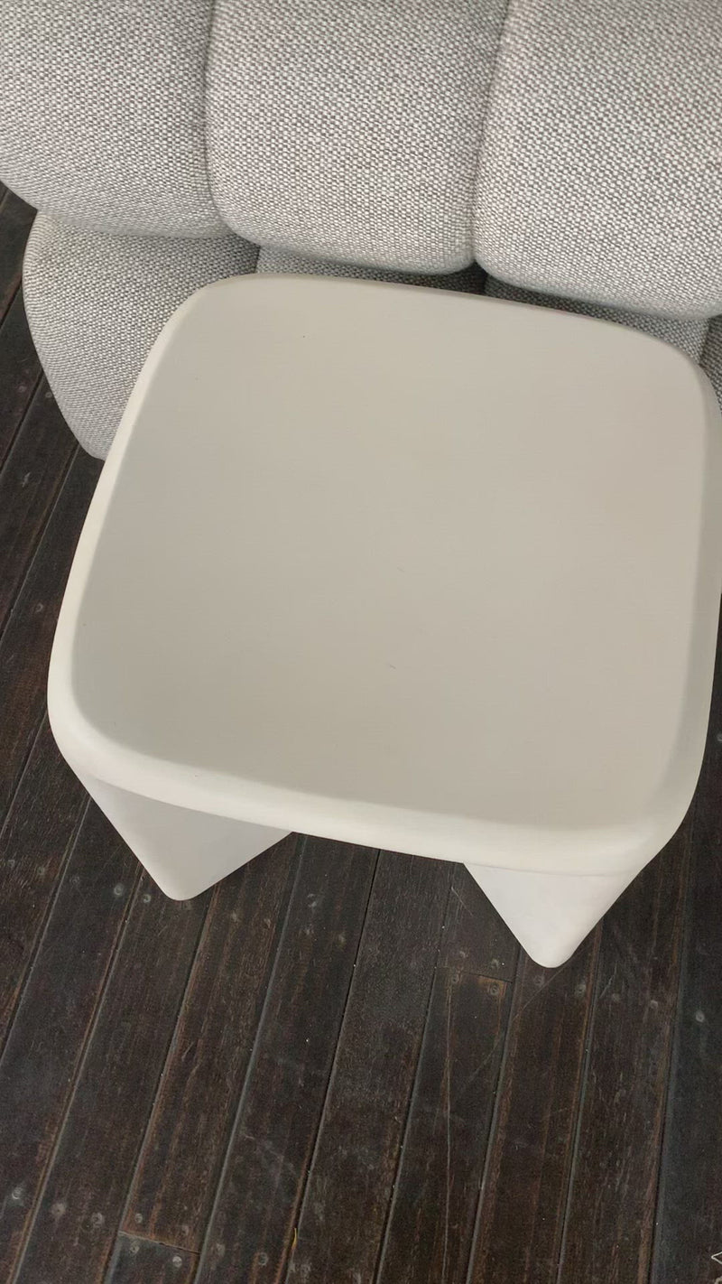A minimalist dream, this Dante End Table - White Concrete is made from white-finished cast concrete with soft, chunky proportions. This would elevate the space for any living room or lounge area.    Overall Dimensions: 19.00"w x 19.00"d x 19.00"h