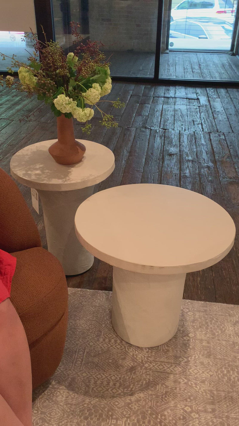 Made from plaster-molded concrete, a pedestal-style base supports a rounded tabletop of smooth, white-finished concrete in this Parra Low End Table - Plaster Molded Concrete. This brings a clean, adobe-inspired vibe to any living room or lounge area. Pair with the matching High End Table for a staggered look!   Overall Dimensions: 20.00"w x 20.00"d x 18.00"h