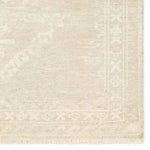 Hand carded wool, soft Tencel, and a neutral color palette define the handknotted Ashend Vavite. The Vavite rug showcases a Moroccan-inspired center medallion in a neutral cream and tan colorway. Geometric detailing establishes a thin border and provides a nod to the tribal styles of northern Africa. Amethyst Home provides interior design, new home construction design consulting, vintage area rugs, and lighting in the Los Angeles metro area.