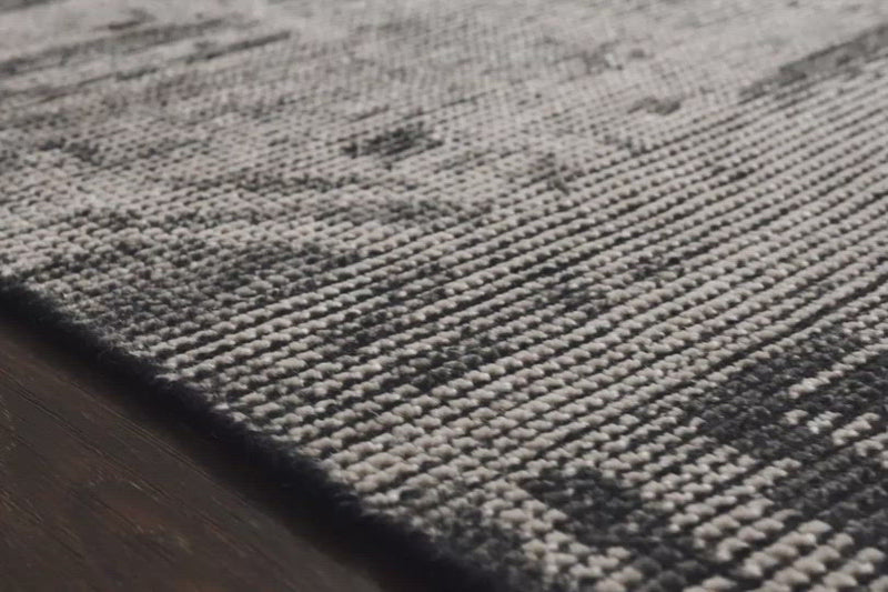 Hand-knotted in India of 100% wool, the Amara Silver/Dark Grey Rug creates a casual yet refined vibe with high-end appeal. Showcase in your bedroom, living room, entryway, or other high-traffic area of your home.   Hand Knotted 100% Wool AMM-02 Silver/Dark Grey