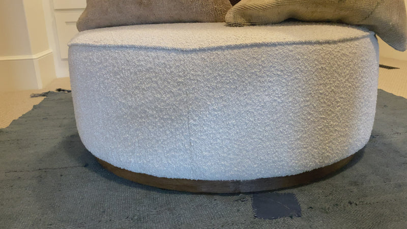 This round ottoman of textural cream boucle can be placed just about anywhere, bringing with it a hip retro vibe.  Overall Dimensions: 36"w x 36"d x 14.5"h