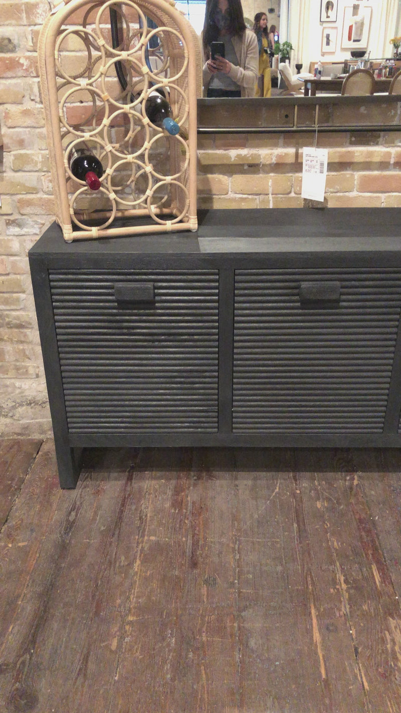 Dark-finished reclaimed woods form a beautifully substantial console, with carved reeding for a linear look with this Lorne Media Console - Dark Reeded Totem. Rear cutouts for cord management make this both a functional and beautiful piece to add to any living room or den. 
